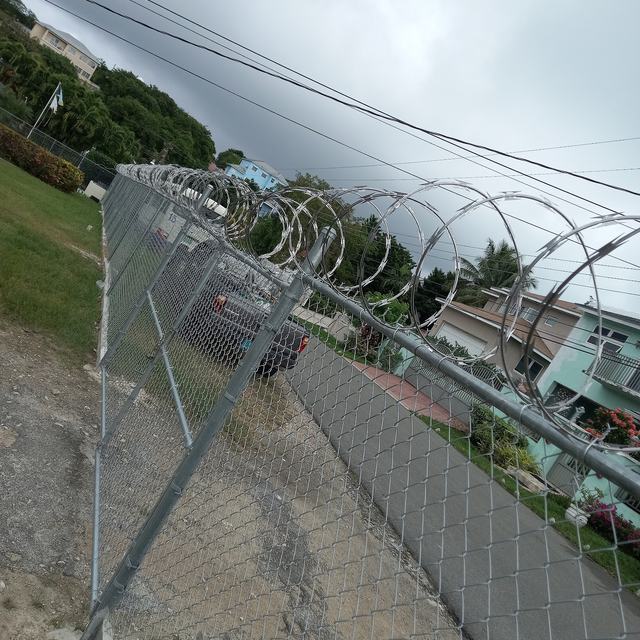 Fence topped with razor wire